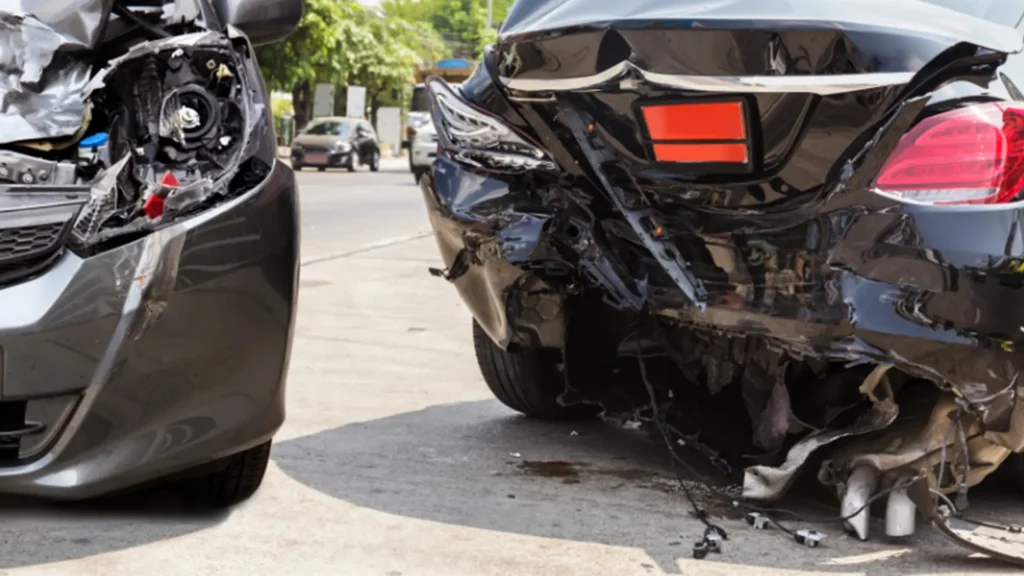 Chain reaction crash involving multiple vehicles causing traffic disruption on the freeway