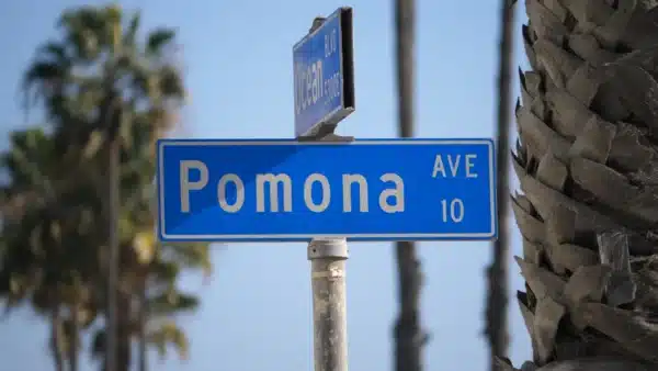 Personal injury lawyer near Pomona meeting with an injured client to discuss accident claim options.